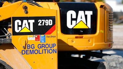 This May 8, 2019 photo shows a Caterpillar 279D Compact Track Loader at a demolition site in Fort Lauderdale, Fla. Caterpillar's revenue rose in the third quarter, bolstered by increased equipment demand and higher prices, Thursday, Oct. 28, 2021.