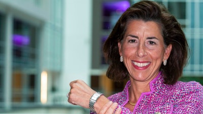 In this Tuesday, Sept. 28, 2021, photo Commerce Secretary Gina Raimondo poses for a photograph with her Bulova watch. Raimondo only wears watches made by Bulova — a company that fired her scientist father, closed its Rhode Island factory and moved production to China in 1983. “It’s been a tribute to my dad,' Raimondo said in an interview, “and a reminder to me that we need to do more to get good manufacturing jobs in America.”