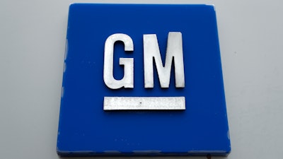 This Jan. 27, 2020 file photo shows a General Motors logo at the General Motors Detroit-Hamtramck Assembly plant in Hamtramck, Mich. General Motors says it’s building a huge new electric vehicle battery lab in Michigan.