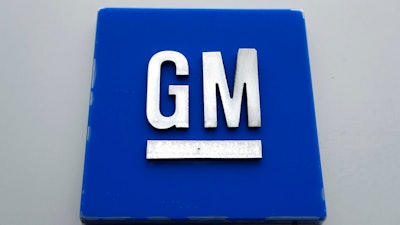This Jan. 27, 2020 photo shows the General Motors logo. High prices for trucks and SUVs helped General Motors post a $2.4 billion third-quarter profit despite factory closures due to a shortage of computer chips and other parts. But the profit was 40% lower than the $4 billion GM made during the same period last year as sales slumped last quarter and the company lost market share in the U.S., its most profitable country.
