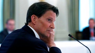 Brian Goldner, chairman of the board and CEO of Hasbro, listens as President Donald Trump speaks during a roundtable with industry executives about reopening the country after coronavirus closures, in the State Dining Room of the White House, Friday, May 29, 2020, in Washington. Toymaker Hasbro Inc. announced Sunday, Oct. 10, 2021, that Goldner is taking a medical leave of absence from his CEO role, effective immediately. The move follows Goldner's disclosure in August 2020 that he was undergoing continued medical treatment for cancer since 2014.