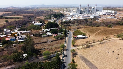 In this Feb. 22, 2020 file photo, a power generation plant stands idle near Huexca, Morelos state, Mexico. A constitutional reform presented by President Andrés Manuel López Obrador would cancel contracts under which some private power generating plants plants sell power into the national grid, declares “illegal” other private plants that sell energy direct to corporate clients in Mexico and would cancel many long-term energy supply contracts and clean-energy preferential buying schemes.