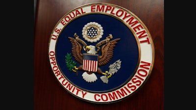 The emblem of the U.S. Equal Employment Opportunity Commission is shown on a podium, Vail, Colo., Feb. 16, 2016.