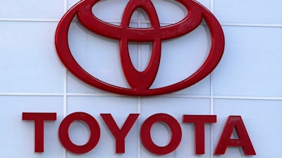 The Toyota logo is shown on a dealership in Manchester, N.H., in this Thursday, Aug. 15, 2019, file photo. Toyota plans to build a new $1.29 billion factory in the U.S. to manufacture batteries for gas-electric hybrid and fully electric vehicles. The plant location wasn't announced, but the company said it eventually will employ 1,750 people and start making batteries in 2025, gradually expanding through 2031.
