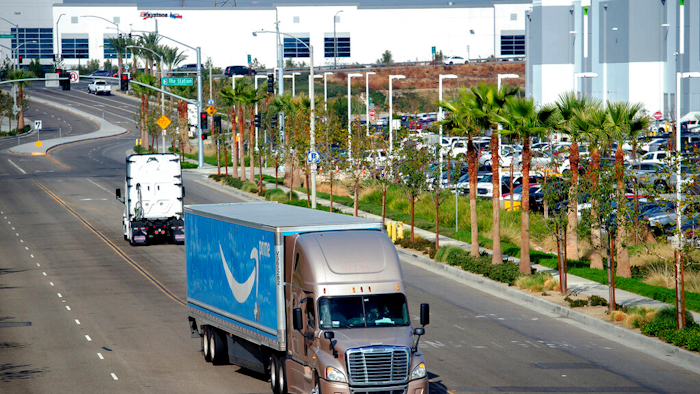 A semi-truck turns into an Amazon Fulfillment center in Eastvale, CA on Nov. 12, 2020.