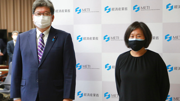 U.S. Trade Representative Katherine Tai, right, poses for a photo with her counterpart Koichi Hagiuda prior to their meeting in Tokyo on Nov. 17, 2021.
