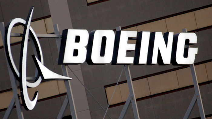 The Boeing Company logo is seen on the property in El Segundo, Calif., Tuesday, Jan. 25, 2011. Insurers for several current and former Boeing board members will pay more than $230 million to settle a lawsuit that accused the directors of failing to address safety warning signs before two of the company’s Max jetliners crashed.