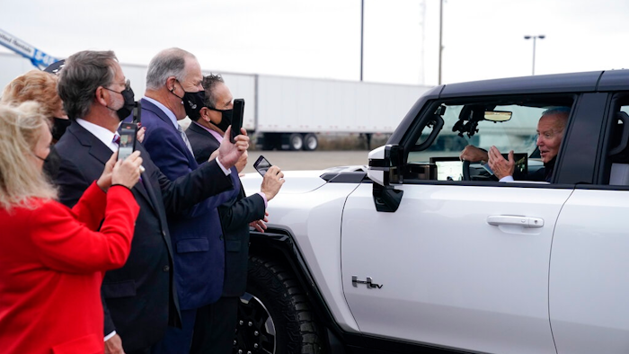 President Joe Biden stops to talk to people as he test drives a Hummer at the General Motors Factory ZERO electric vehicle assembly plant during a tour Wednesday, Nov. 17, 2021, in Detroit. (AP Photo/Evan Vucci)