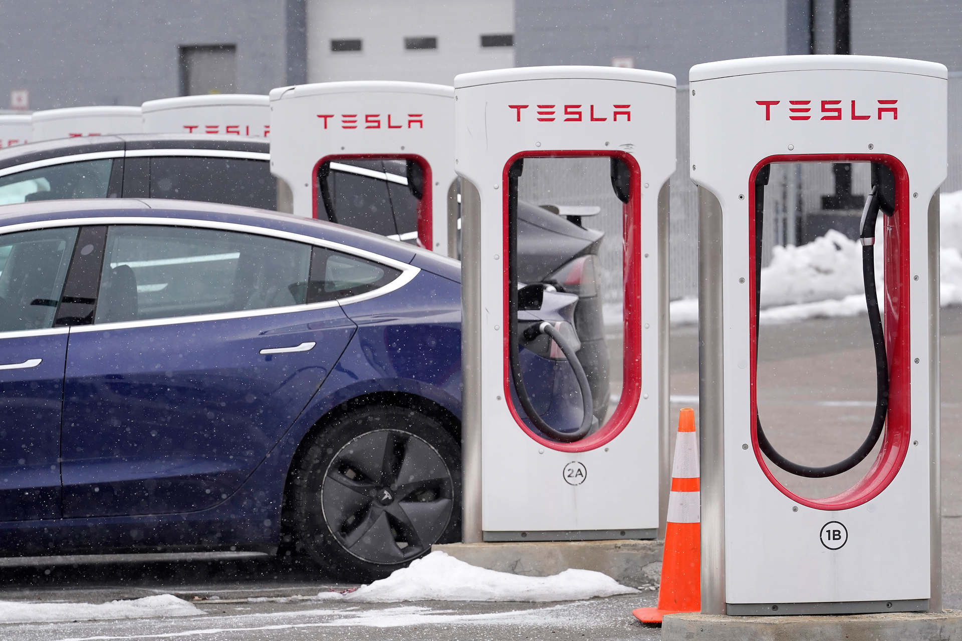 A Tesla vehicle at a charging station at a dealership in Dedham, Mass., Feb. 18, 2021.