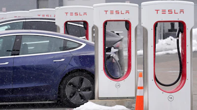 A Tesla vehicle at a charging station at a dealership in Dedham, Mass., Feb. 18, 2021.