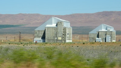 The decommissioned plutonium-producing DR reactor, left, and D reactor, right, on the Hanford Nuclear Reservation near Richland, Wash., June 13, 2017.