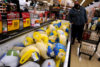 People shop for frozen turkeys for Thanksgiving dinner at a grocery store in Mount Prospect, Ill., Wednesday, Nov. 17, 2021. First, the good news: There is no shortage of whole turkeys in the U.S. this Thanksgiving. But those turkeys — along with other holiday staples like cranberry sauce and pie filling — could cost more.