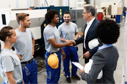Happy Corporate Manager Shaking Hands With A Worker While Visiting A Factory 1151857619 2125x1417