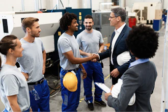 Happy Corporate Manager Shaking Hands With A Worker While Visiting A Factory 1151857619 2125x1417