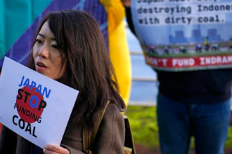 Activists protest against Japan's support of the coal industry near the COP26 U.N. Climate Summit in Glasgow, Scotland, Thursday, Nov. 4, 2021. The U.N. climate summit in Glasgow gathers leaders from around the world, in Scotland's biggest city, to lay out their vision for addressing the common challenge of global warming.