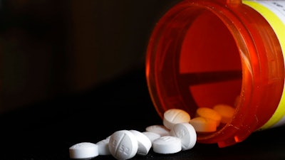This photo shows an arrangement of Oxycodone pills in New York on Aug. 29, 2018. The Oklahoma Supreme Court has overturned a $465 million opioid ruling against drugmaker Johnson & Johnson, finding that a lower court wrongly interpreted the state's public nuisance law. The court ruled in a 5-1 decision Tuesday, Nov. 9, 2021, that the district court in 2019 was wrong to find that New Jersey-based J&J and its Belgium-based subsidiary Janssen Pharmaceuticals violated the state's public nuisance statute.
