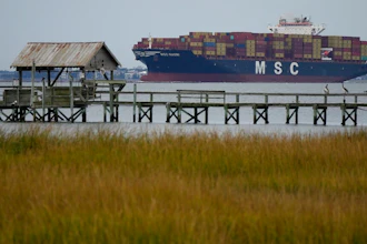 The MSC Naomi container ship sails out from from the port of Charleston, S.C.,Thursday, Oct. 28, 2021. Hampered by rising COVID-19 cases and persistent supply shortages, the U.S. economy slowed sharply to a 2% annual growth rate in the July-September period, the weakest quarterly expansion since the recovery from the pandemic recession began last year.
