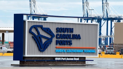 A sign marks the site of a new South Carolina Ports Authority terminal named for longtime state Sen. Hugh Leatherman on Monday, Oct. 25, 2021, in North Charleston, S.C. Currently, the International Longshoremen's Association is calling on the Biden administration for help resolving a labor dispute at the terminal.