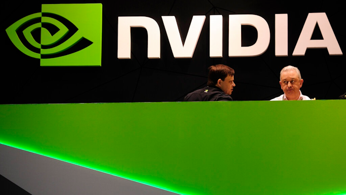 People gather in the Nvidia booth at the Mobile World Congress mobile phone trade show Thursday, Feb. 27, 2014 in Barcelona, Spain. The Federal Trade Commission on Thursday, Dec. 2, 2021 sued to block graphics chip maker Nvidia’s $40 billion purchase of chip designer Arm, saying the deal would create a powerful company that could hurt the growth of new technologies.