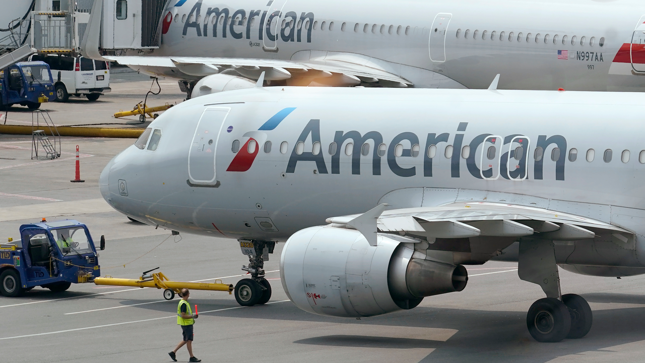American Airlines passenger jets prepare for departure at Boston Logan International Airport, July 21, 2021.
