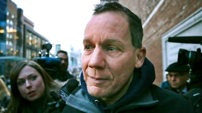 Harvard University professor Charles Lieber departs federal court, in Boston, Jan. 30, 2020, following his arrest on allegations he hid his involvement in a program designed to recruit people with knowledge of foreign technology and intellectual property to China. Jury selection is slated to start Tuesday, Dec. 14, 2021, in the trial of Lieber, the former chair of Harvard's department of chemistry and chemical biology.