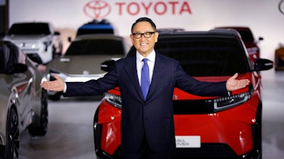 Toyota Motor Corp. President Akio Toyoda gestures for photographers during a press conference regarding battery EV strategies Tuesday, Dec. 14, 2021, in Tokyo.
