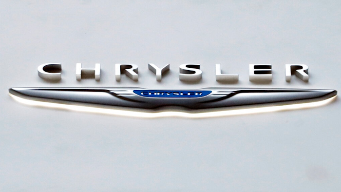 The Chrysler logo at the 2019 Pittsburgh International Auto Show is displayed on Feb. 14, 2019. Chrysler says, Wednesday, Jan. 5, 2022, it plans for its vehicle lineup to go all electric by 2028. It's the latest brand to announce a major shift away from gas-powered cars amid pressure to act on climate change.