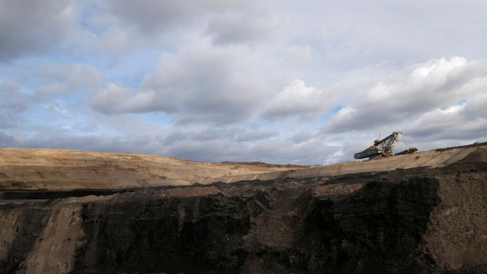 In this file photo taken on Thursday, Nov. 12, 2015 near the town of Most, Czech Republic, a huge excavator stands inside a giant open pit lignite mine. On Friday Jan. 7, 2022, the new Czech government pledged to work for the country to be able to phase out coal as an energy source by 2033.