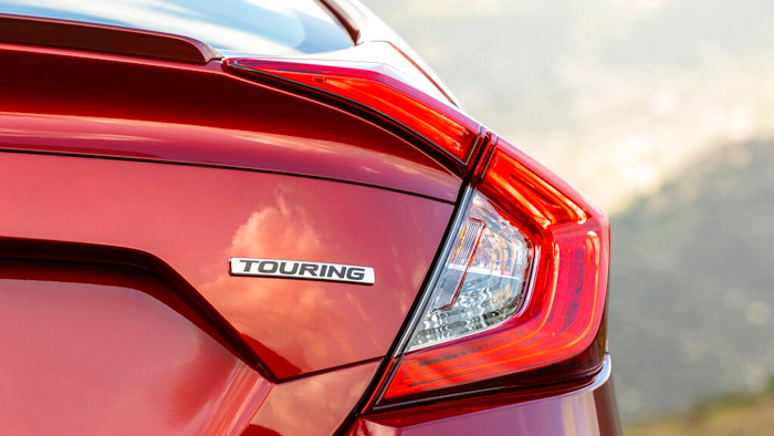 This undated photo provided by American Honda Motor Co. shows a trim name on a Honda Civic. In the trim lineup, Touring trims are typically more loaded with features than entry-level LX trims.