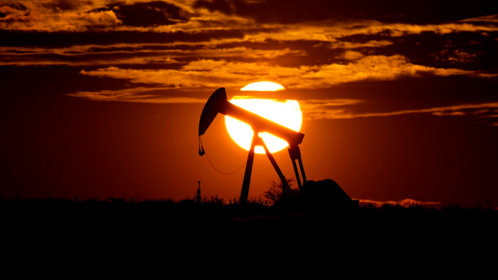 In this April 8, 2020 file photo, the sun sets behind an idle pump jack near Karnes City, USA. The 23-member OPEC+ group, led by member Saudi Arabia and non-member Russia, meets online to decide production levels from February. Analysts say the group is likely to add 400,000 barrels per day, sticking with the road map they have followed since August to add back that much oil each month.