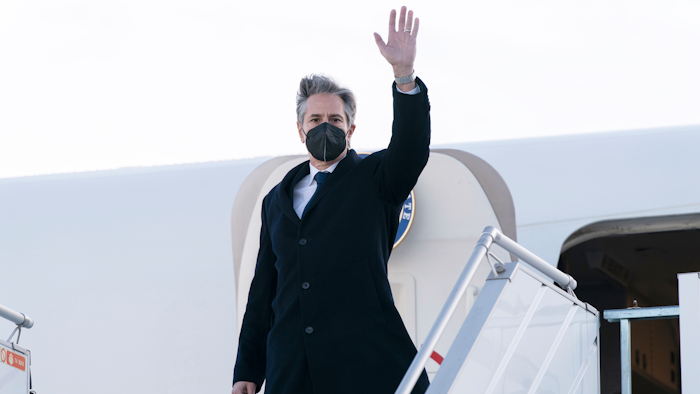 Secretary of State Antony Blinken waves as he departs the Geneva Airport, Friday, Jan. 21, 2022, in Geneva, Switzerland.