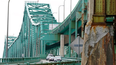Drivers take an exit ramp off the Tobin Memorial Bridge on March 31, 2021, in Chelsea, Mass.