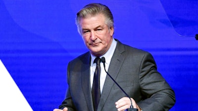 Alec Baldwin performs emcee duties at the Robert F. Kennedy Human Rights Ripple of Hope Award Gala at New York Hilton Midtown on Dec. 9, 2021, in New York. Baldwin said Saturday, Jan. 8, 2022, any suggestion that he's not cooperating with a probe into last fall's shooting on his movie set that killed cinematographer Halyna Hutchins is a lie. He responded via Instagram to stories that discussed why authorities who served him with a search warrant for his phone haven't gotten it yet.