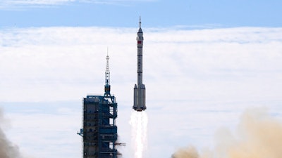 A Long March-2F Y12 rocket carrying a crew of Chinese astronauts in a Shenzhou-12 spaceship lifts off at the Jiuquan Satellite Launch Center in Jiuquan in northwestern China, Thursday, June 17, 2021. China has recommitted itself to completing its orbiting space station by the end of the year and says it is planning more than 40 launches for 2022, putting it roughly level with the United States.