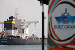 A cargo ship sails through the town of Ismailia, Egypt, March 30, 2021. Egypt’s Suez Canal said Sunday, Jan. 2, 2022, that its annual revenues reached $6.3 billion last year, the highest in the crucial waterway's history.