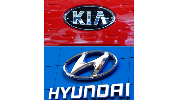 This combination of file photos shows the logo of Kia Motors Dec. 13, 2017, in Seoul, South Korea, top, and Hyundai logo April 15, 2018, in the south Denver suburb of Littleton, Colo., bottom. Hyundai and Kia are telling the owners of nearly 485,000 vehicles in the U.S., Tuesday, Feb. 8, 2022, to park them outdoors because they can catch fire.