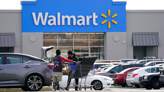 Shown is a Walmart location in Philadelphia, Wednesday, Nov. 17, 2021. Walmart is reporting strong fiscal fourth-quarter results that exceeded analysts' expectations as the nation's largest retailer defies higher inflation and supply chain issues. Walmart said Thursday, Feb. 17, 2022, that net income was $3.56 billion, or $1.28 per share in the quarter ended Jan. 31. That compares with a loss of $2.91 billion, or loss of 74 cents. Revenue was $151.5 billion.
