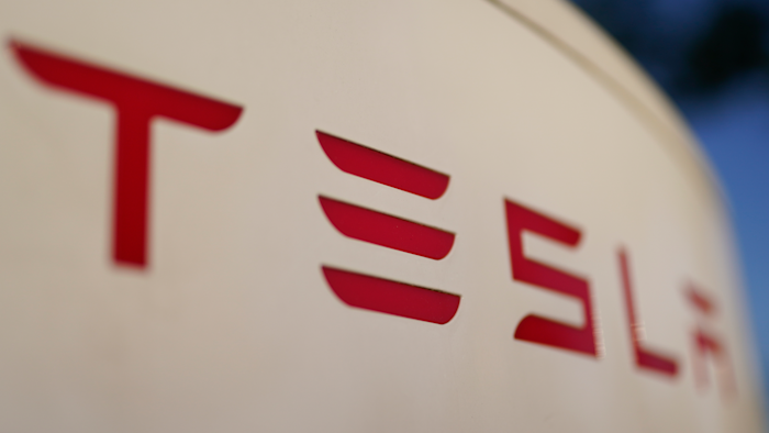 The logo for the Tesla Supercharger station is seen in Buford, GA, April 22, 2021.