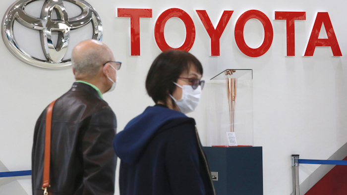 Toyota is suspending production at all 28 lines of its 14 plants in Japan starting Tuesday, because of a “system malfunction” at a domestic supplier, the automaker said Monday, Feb. 28, 2022.