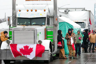 Truckers and supporters block the access leading from the Ambassador Bridge, linking Detroit and Windsor, as truckers and their supporters continue to protest against COVID-19 vaccine mandates and restrictions, in Windsor, Ontario on Feb. 11, 2022.