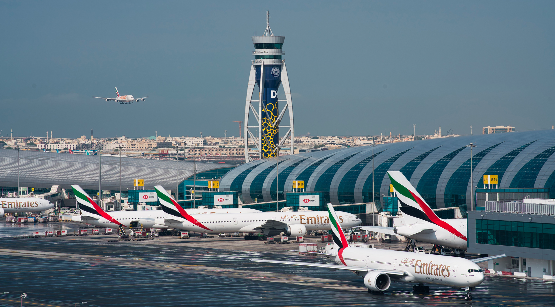 An Emirates jetliner comes in for landing at Dubai International Airport, Dec. 11, 2019.