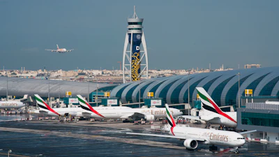 An Emirates jetliner comes in for landing at Dubai International Airport, Dec. 11, 2019.