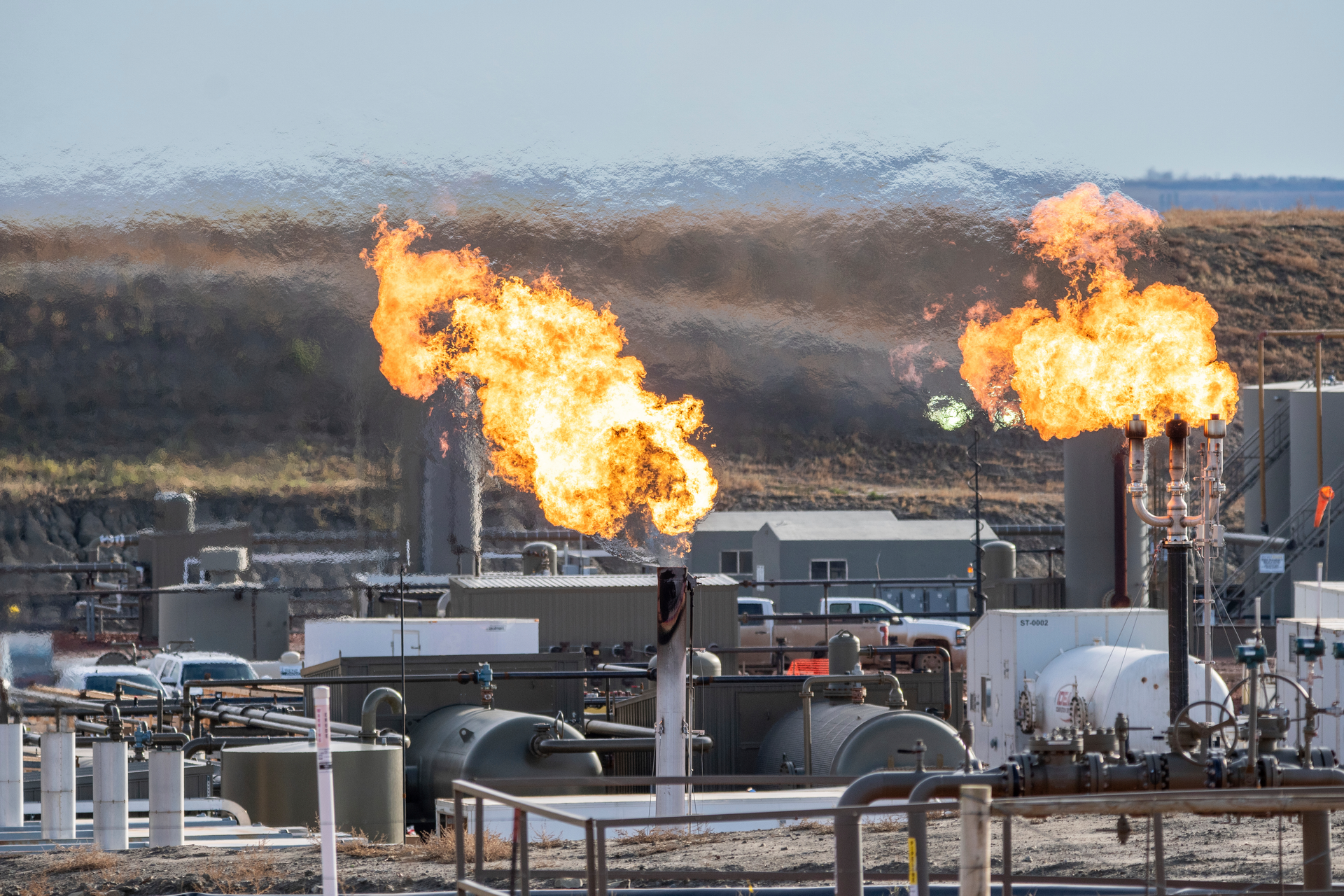 Flares burn on the Fort Berthold Indian Reservation in North Dakota, Oct. 27, 2021.