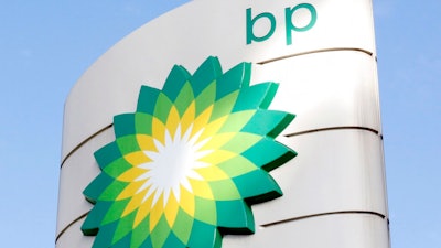 A view of the BP logo at a petrol station in London, Tuesday, Aug. 1, 2017. BP PLC reported its biggest full-year profit for eight years on Tuesday, Feb. 8, 2022 its coffers boosted by soaring oil and gas prices that have hiked domestic fuel bills for millions of people.
