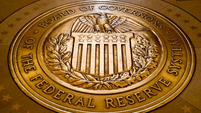 In this Feb. 5, 2018, file photo, the seal of the Board of Governors of the United States Federal Reserve System is displayed in the ground at the Marriner S. Eccles Federal Reserve Board Building in Washington. Federal Reserve Governor Christopher Waller said Thursday, Feb. 24, 2022 he is willing to support a half-point interest rate hike at the central bank's next meeting in March if upcoming data suggests inflation is worsening.