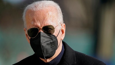 President Joe Biden walks on the South Lawn of the White House after stepping off Marine One, Sunday, Feb. 6, 2022, in Washington. Biden returned to Washington after spending the weekend at his home in Delaware.