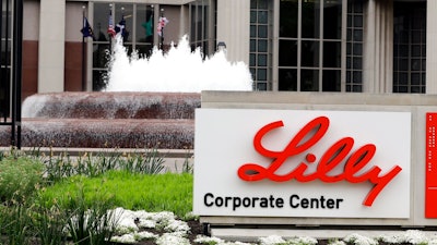In this April 26, 2017, file photo shows the Eli Lilly and Co. corporate headquarters in Indianapolis. The Biden administration says it has purchased enough doses of a yet-to-be approved antibody drug to treat 600,000 patients with COVID-19. The medicine from pharmaceutical giant Eli Lilly will be shipped out to states free of charge if the Food and Drug Administration approves the company’s request for emergency use authorization, said Health and Human Services Secretary Xavier Becerra.