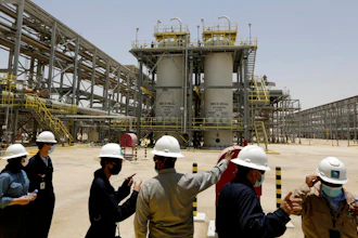 Saudi Aramco engineers and journalists look at the Hawiyah Natural Gas Liquids Recovery Plant, which is designed to process 4.0 billion standard cubic feet per day of sweet gas, a natural gas that does not contain significant amounts of hydrogen sulfide, in Hawiyah, in the Eastern Province of Saudi Arabia, June 28, 2021. Leaders of the world's most consequential energy bodies gathered for a forum Wednesday, Feb. 16, 2022, to discuss the uncertain future of oil as demand rebounds and prices climb, all while a growing roster of nations pledge to transition to cleaner forms of energy.