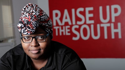 Food service worker Sheree Allen poses in the Raise Up offices, a branch of the Fight for $15 union, Thursday, Feb. 10, 2022, in Durham, N.C. After decades of decline, U.S. unions have a new reason for hope: younger workers.