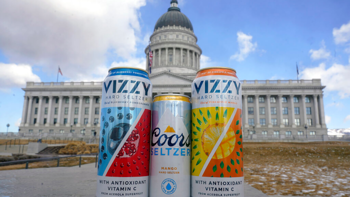 A can of Coors Seltzer Mango, center, is shown with Vizzy Blueberry Pomegranate, left, and Vizzy Pineapple Mango, in front of the Utah State Capitol on Feb. 17, 2022, in Salt Lake City.
